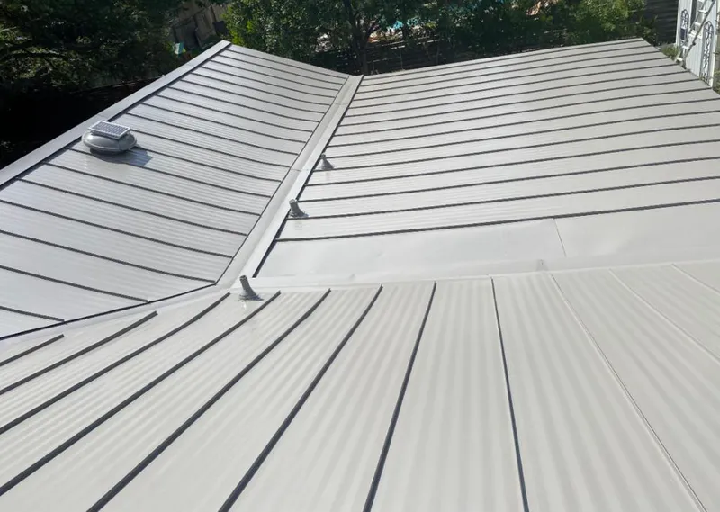 Solar attic fan installed on a metal roof for Roof Ventilation in DeBary